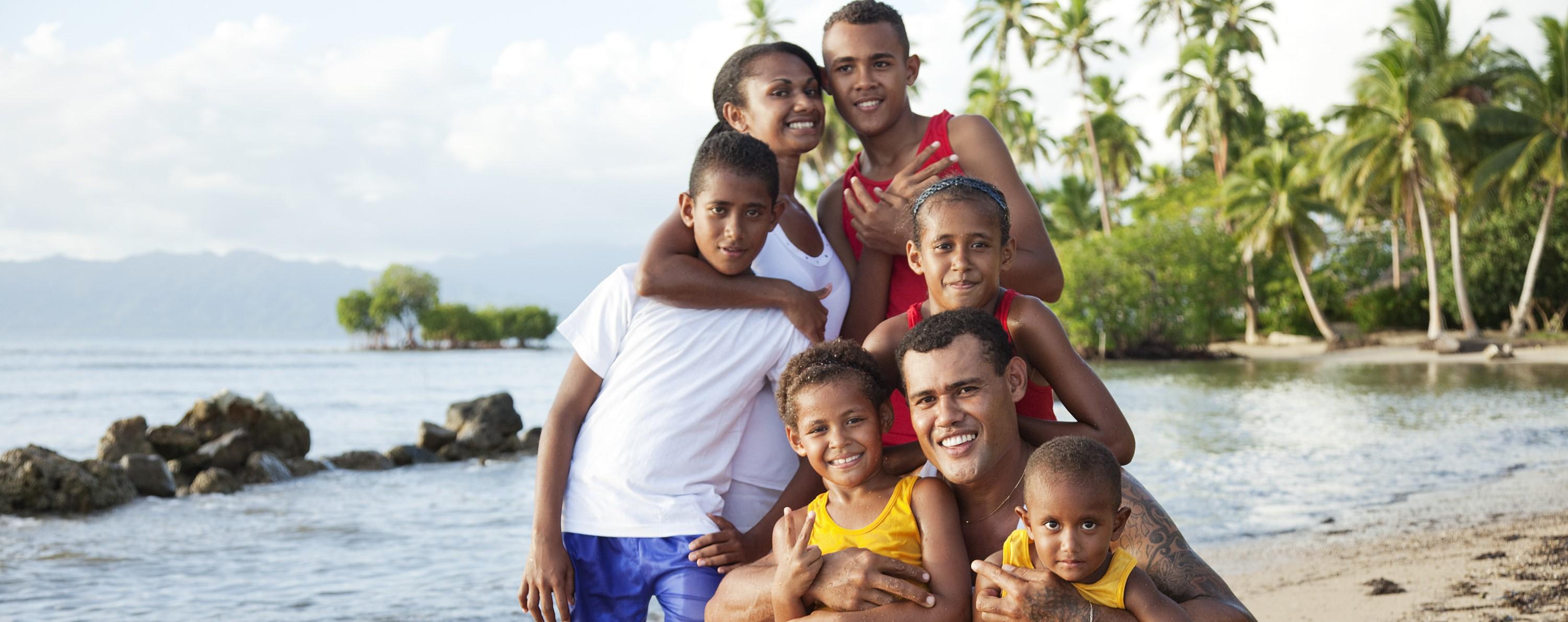 A group of people hugging and smiling